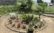 中庭　円形の花壇と舗装したスペースがあり、植物や自然を楽しむことが出来ます。（グループホームケアクオリティ望静大前）